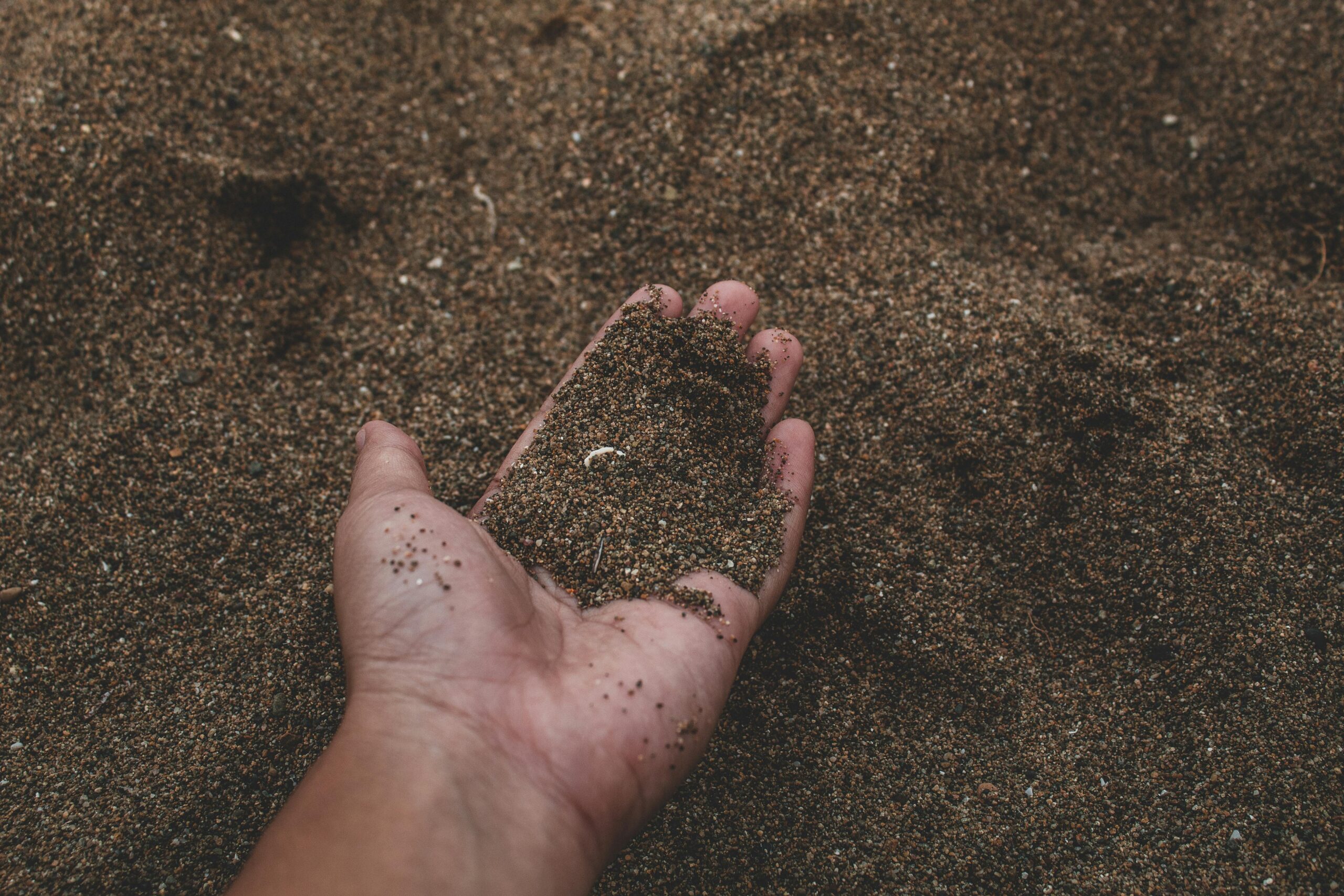 Photo by Muffin Creatives: https://www.pexels.com/photo/close-up-photo-of-person-holding-sand-2203683/