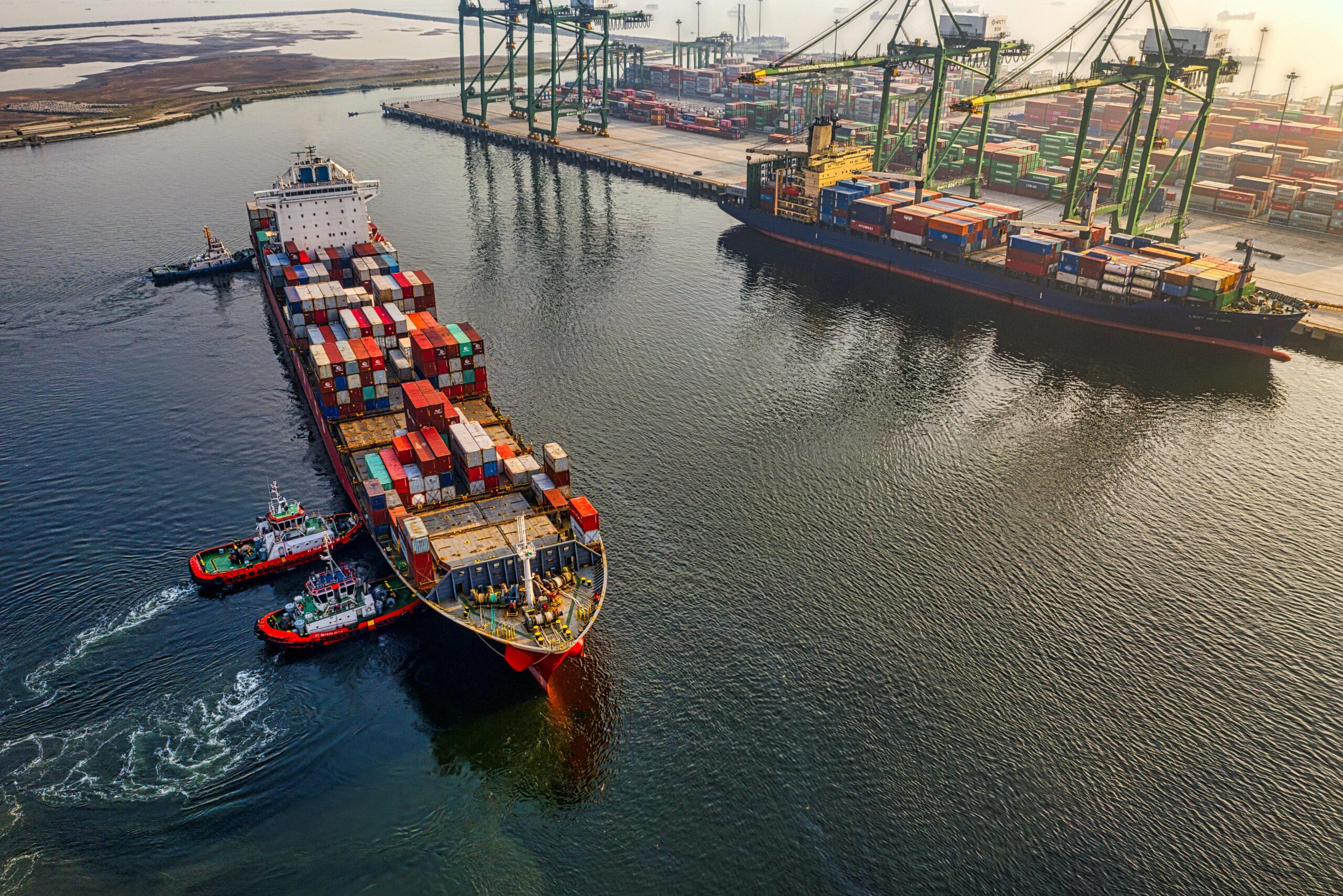 Photo by Tom Fisk: https://www.pexels.com/photo/aerial-shot-of-cargo-ship-on-sea-3840441/